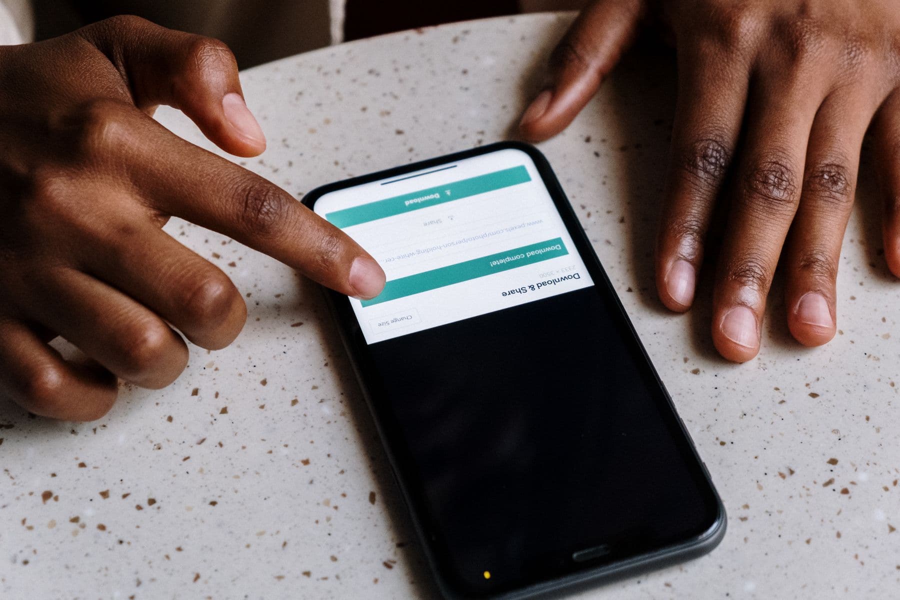 Hands using a mobile app on a smartphone